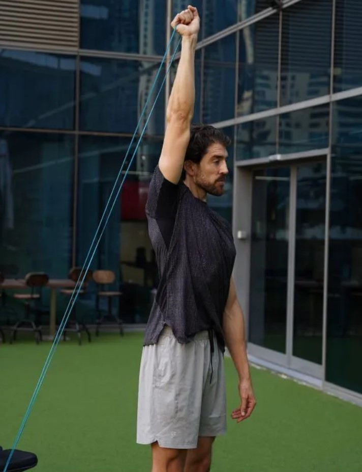 Man performing a triceps band extension