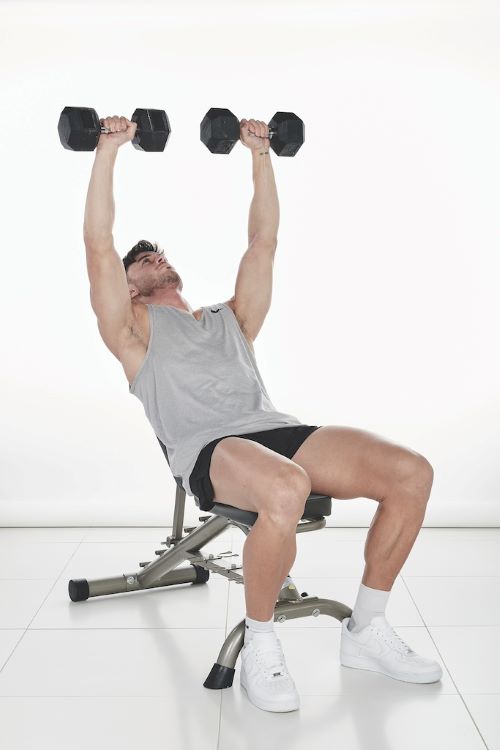 Man performing a Incline dumbbell bench press