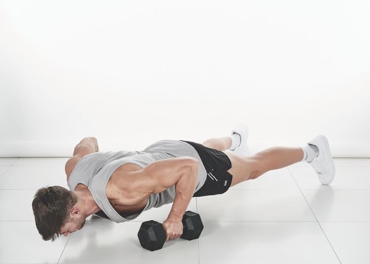 Man performing a dumbbell press-up