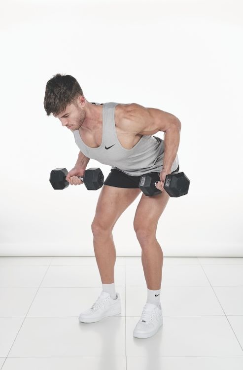 Man performing a bent-over dumbbell reverse row