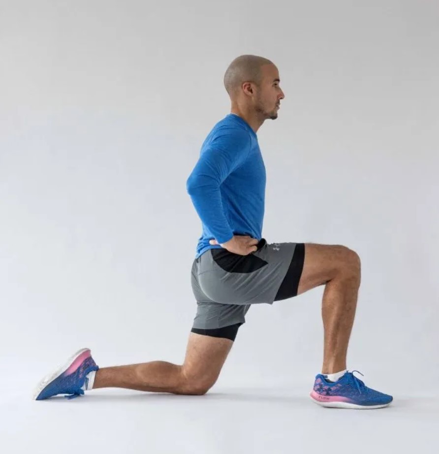 Man performing a lunge hip flexor stretch