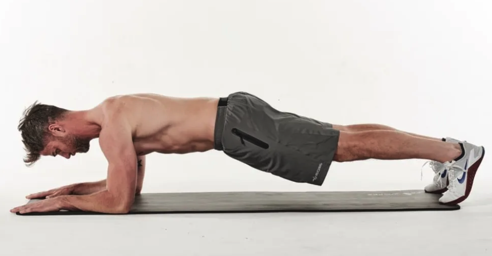 man performing a plank as 