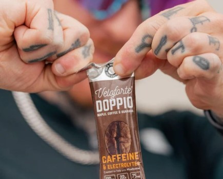 Close-up of a man opening an energy gel