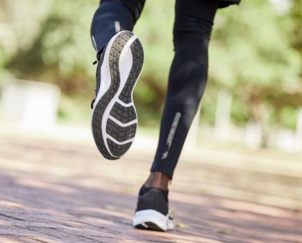 Close up of a man's lower legs and running shoes