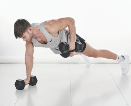 Man performing a dumbbell push-up to renegade row