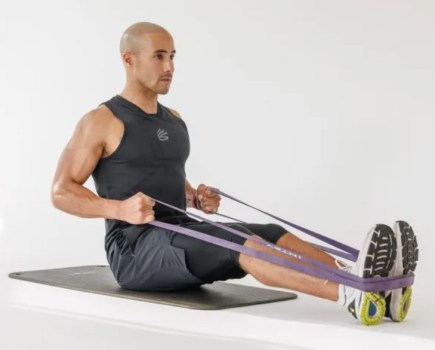 Man performing a seated row