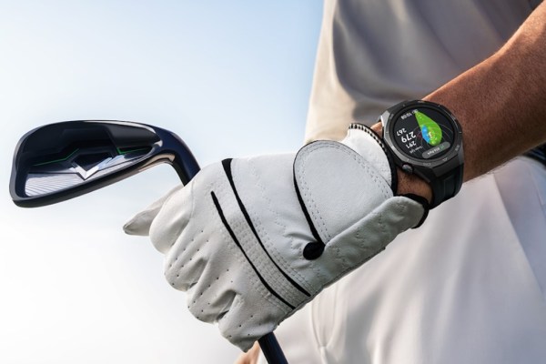 Close-up of a golfer's arm, holding a club